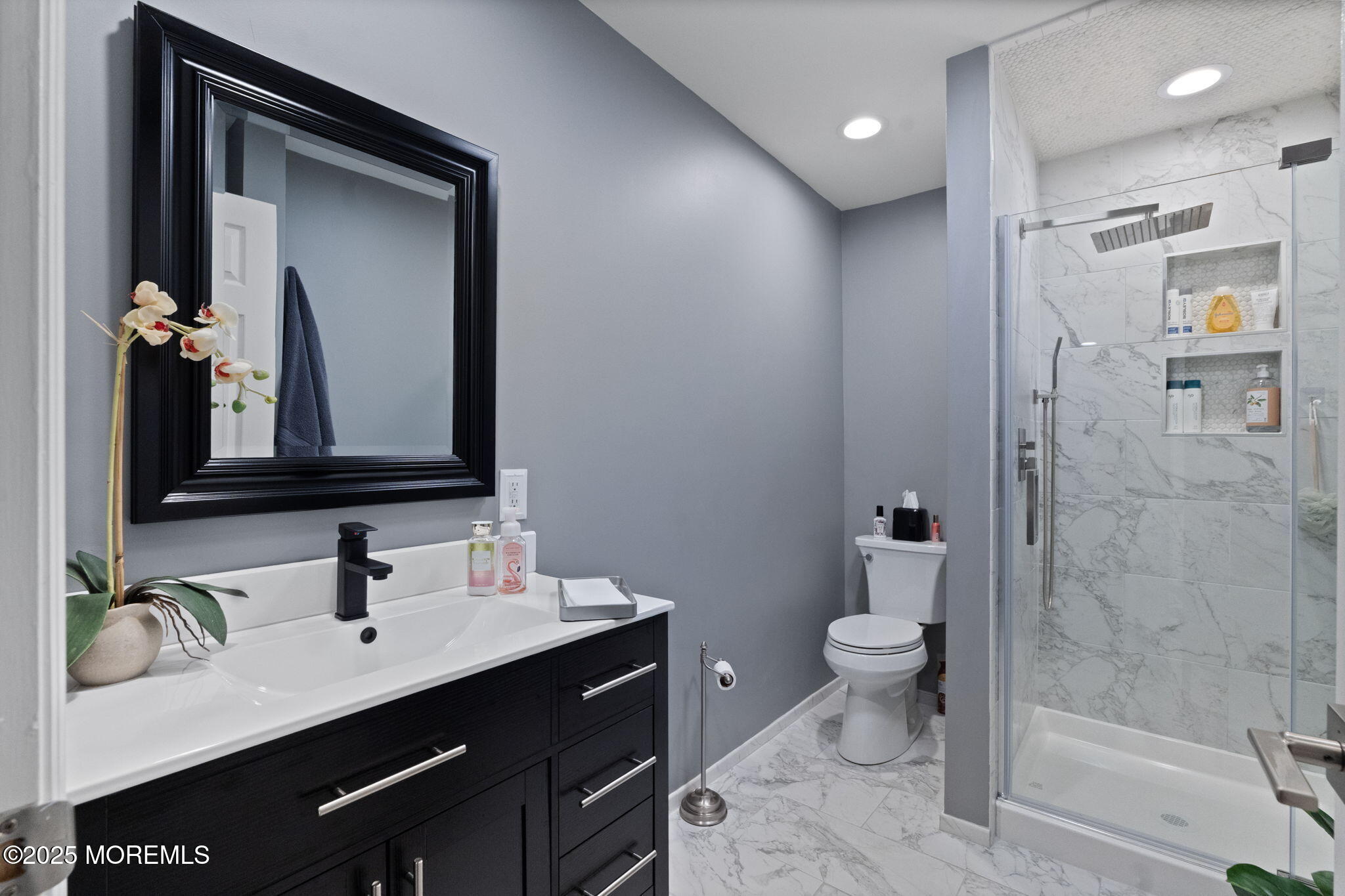 93 Wallace Road Middletown, NJ 07748 - Photo 29 of 47 a bathroom with a double vanity sink toilet and shower