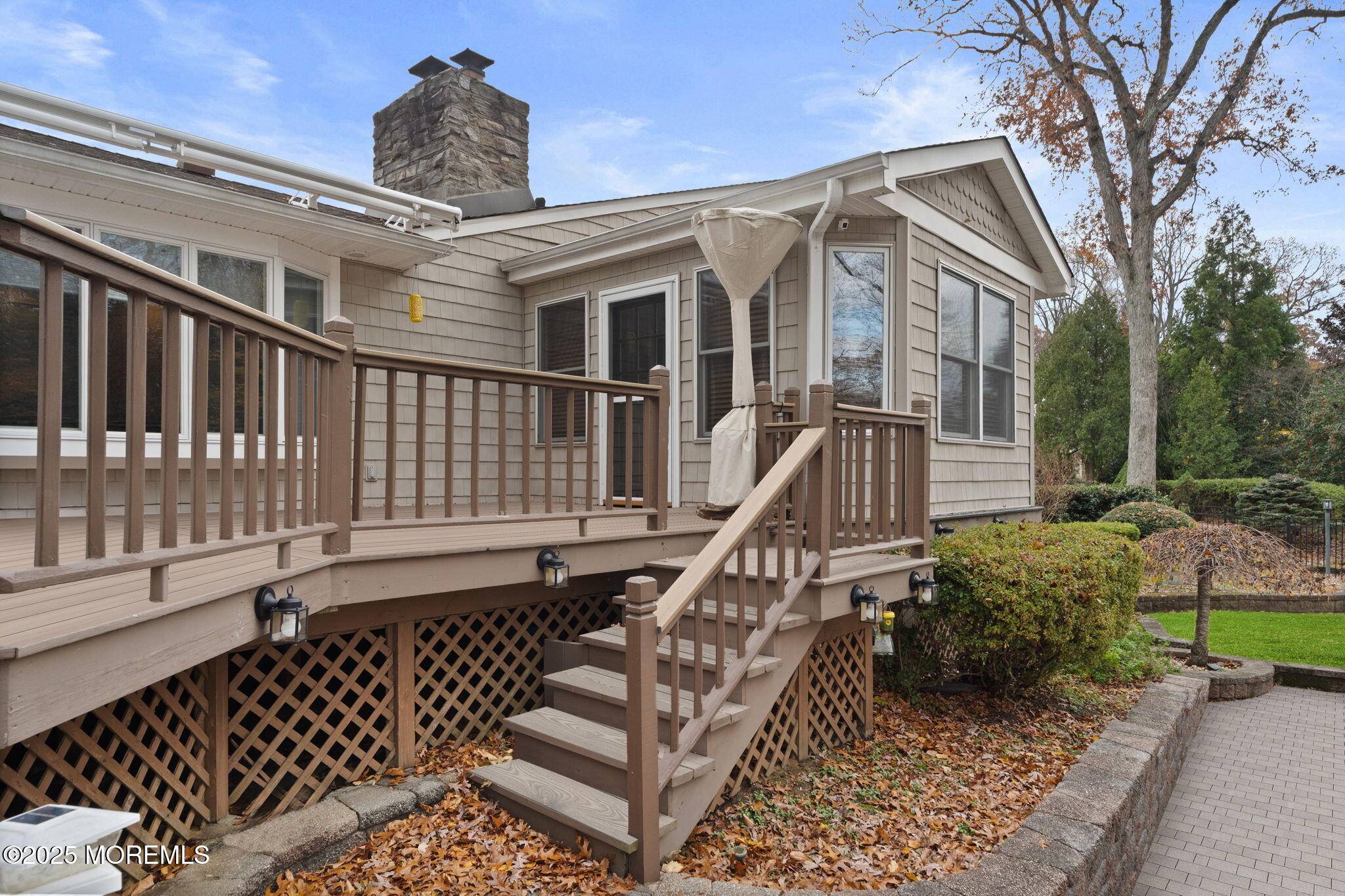 93 Wallace Road Middletown, NJ 07748 - Photo 38 of 47 a view of a house with wooden deck and furniture