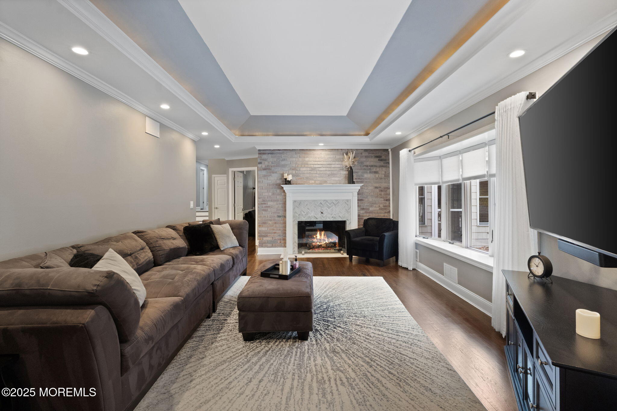 93 Wallace Road Middletown, NJ 07748 - Photo 5 of 47 a living room with furniture and a fireplace