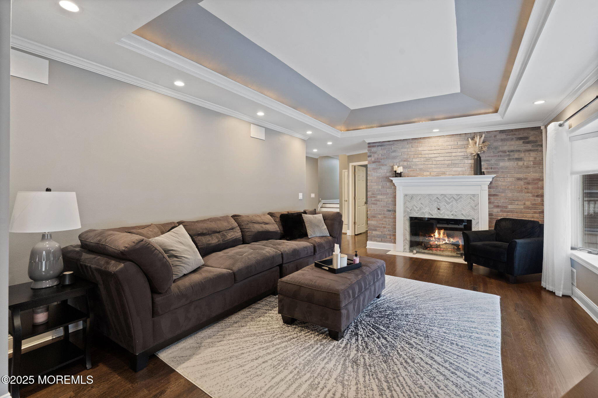 93 Wallace Road Middletown, NJ 07748 - Photo 8 of 47 a living room with furniture and a fireplace