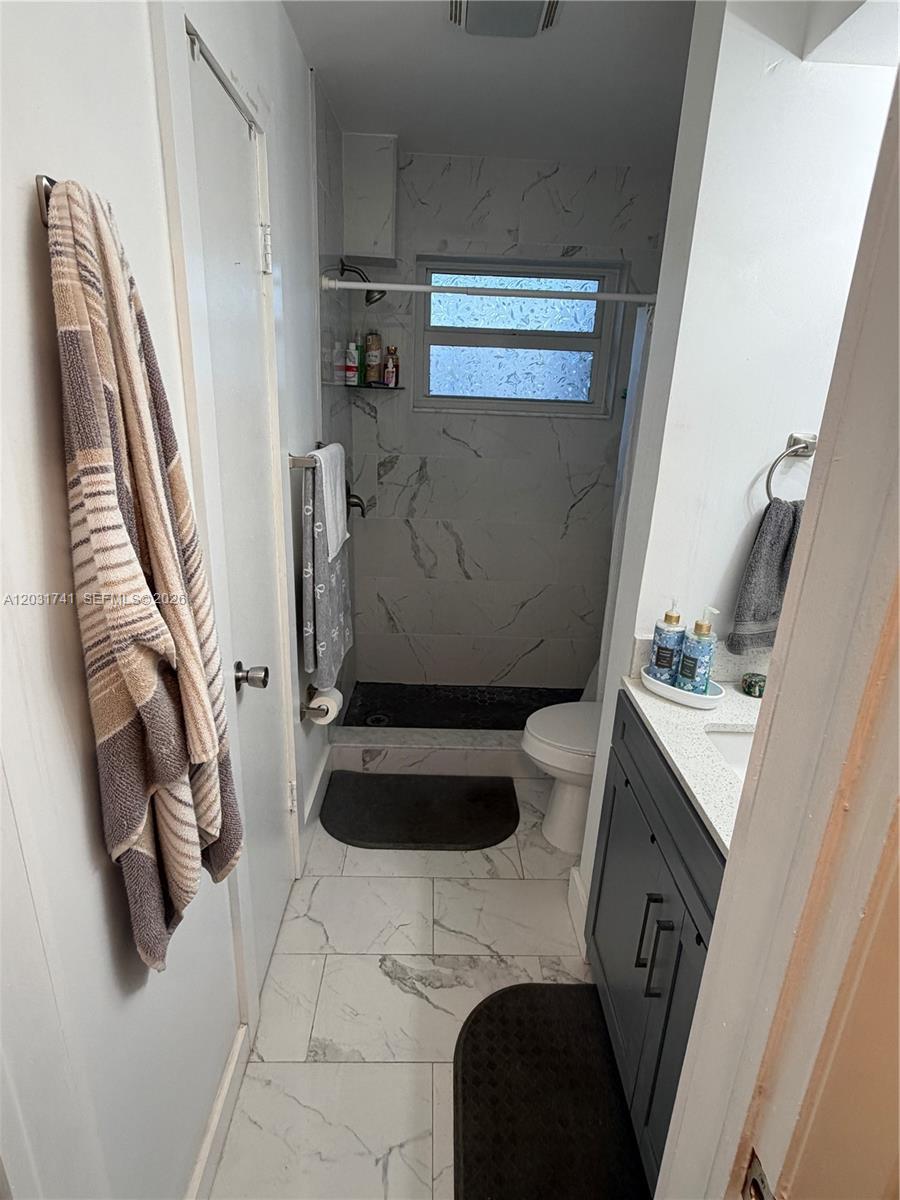 3500 Harrison Street, Unit 4 Hollywood, FL 33021 - Photo 10 of 10 a bathroom with a sink and a mirror