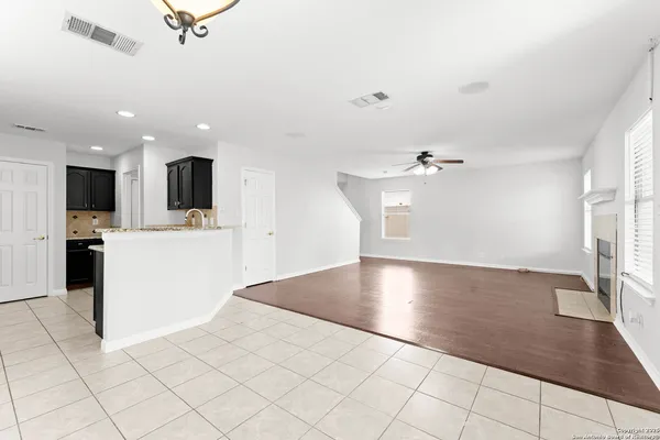 a view of a kitchen with microwave and cabinets
