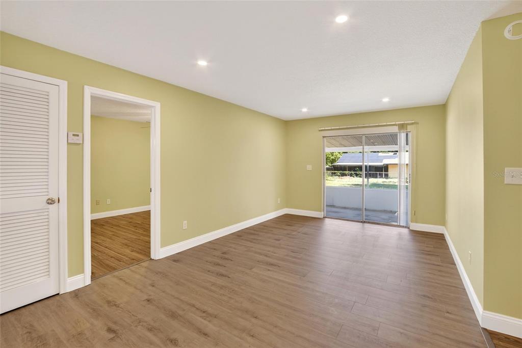 2340 Merrily Circle South Seffner, FL 33584 - Photo 33 of 52 an empty room with wooden floor and windows