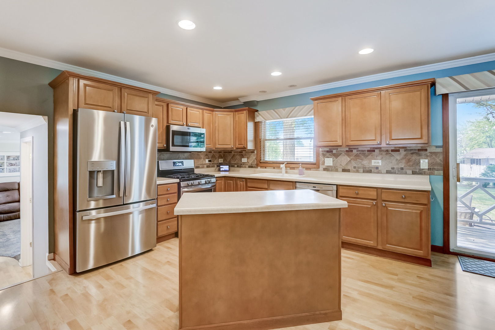 875 Harrison Lane Hoffman Estates, IL 60192 - Photo 9 of 31 a kitchen with stainless steel appliances granite countertop a refrigerator a stove top oven a sink and dishwasher with wooden floor