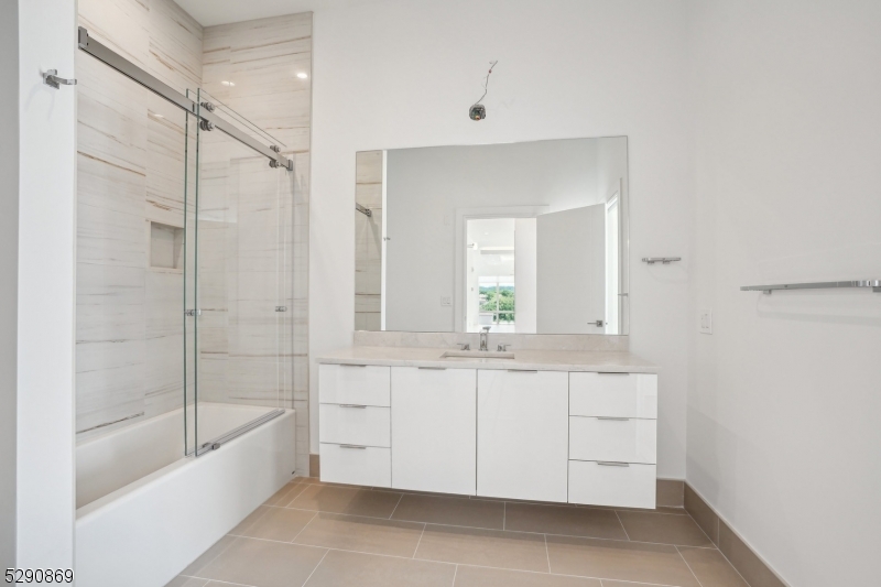 620 Bloomfield Avenue, Unit PHD Bloomfield, NJ 07003 - Photo 17 of 24 a bathroom with a bathtub and a sink