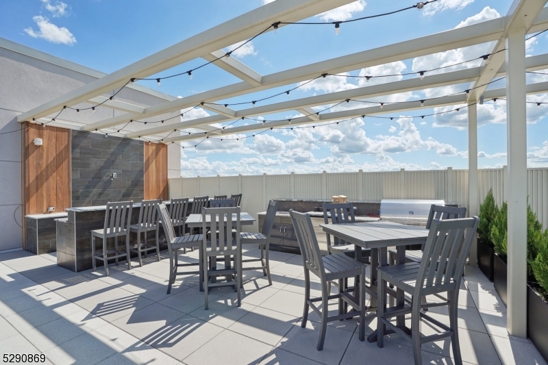 620 Bloomfield Avenue, Unit PHD Bloomfield, NJ 07003 - Photo 19 of 24 a view of a dinning table and chairs in the patio