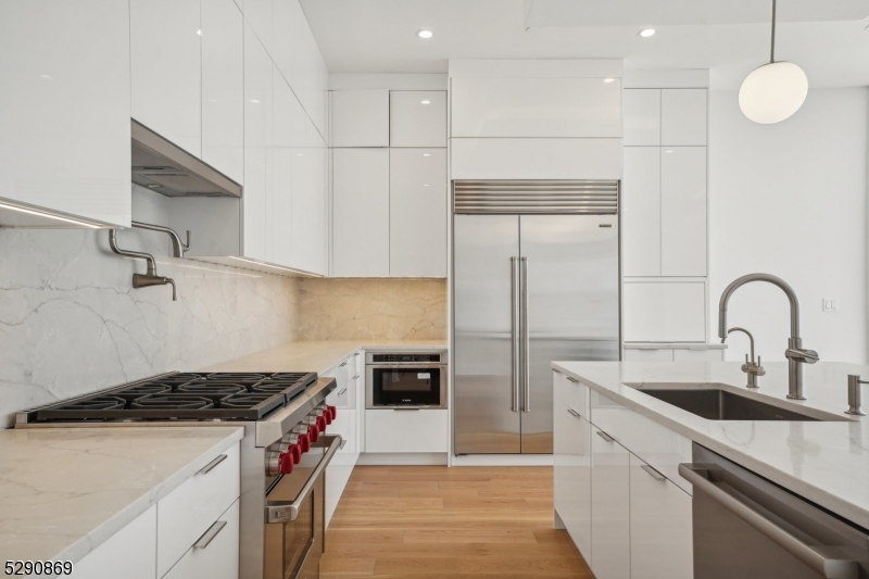 620 Bloomfield Avenue, Unit PHD Bloomfield, NJ 07003 - Photo 2 of 24 a kitchen with stainless steel appliances granite countertop a sink a stove and a refrigerator