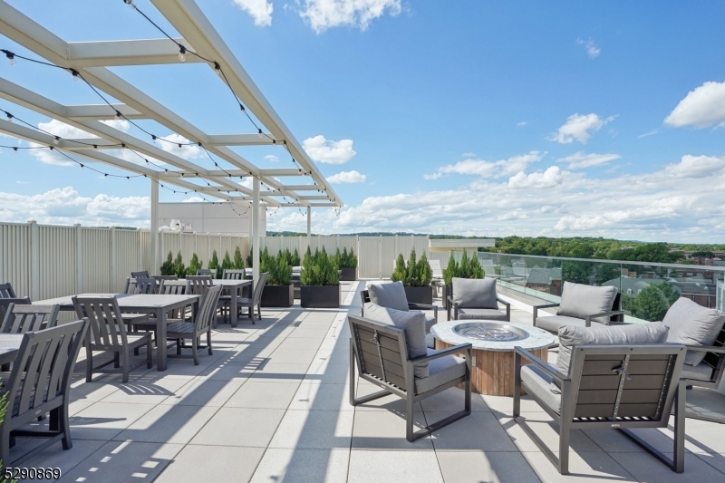 620 Bloomfield Avenue, Unit PHD Bloomfield, NJ 07003 - Photo 21 of 24 a view of a patio with a dining table and chairs with a patio