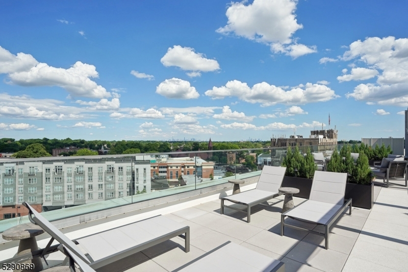 620 Bloomfield Avenue, Unit PHD Bloomfield, NJ 07003 - Photo 22 of 24 a view of a terrace with seating area and city view