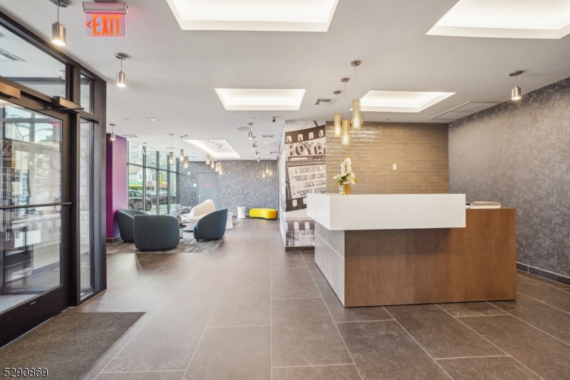 620 Bloomfield Avenue, Unit PHD Bloomfield, NJ 07003 - Photo 24 of 24 a view of living room with stainless steel appliances furniture a rug and a window