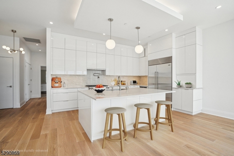 620 Bloomfield Avenue, Unit PHD Bloomfield, NJ 07003 - Photo 6 of 24 a large white kitchen with lots of counter space and refrigerator