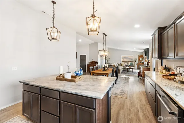 a kitchen with sink and refrigerator