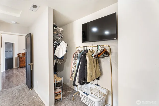 a view of a living room with a flat screen tv