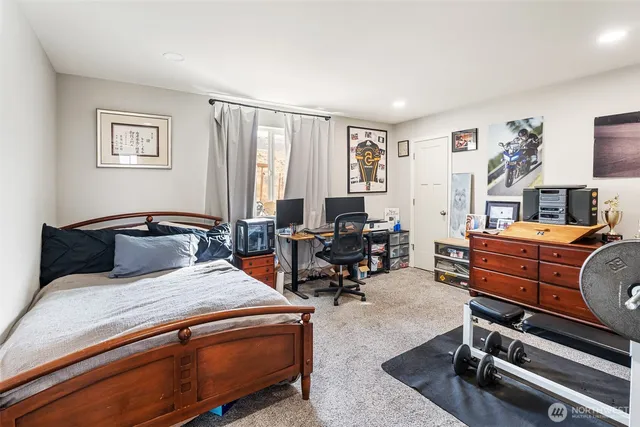 a bedroom with two beds and furniture