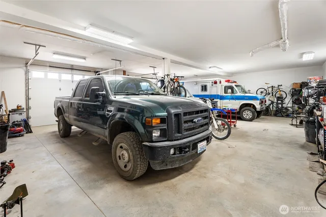 a car and bike parked in a garage