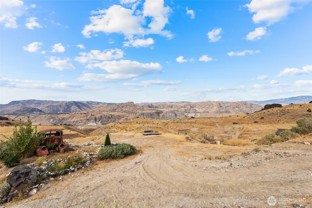 a view of an ocean and a mountain