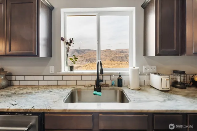 a kitchen with a sink and a window