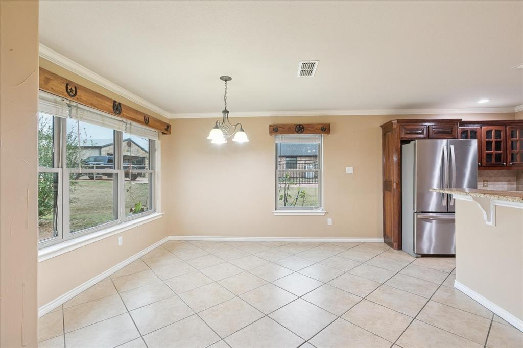 548 Highland Road Springtown, TX 76082 - Photo 11 of 40 a view of an empty room with a window
