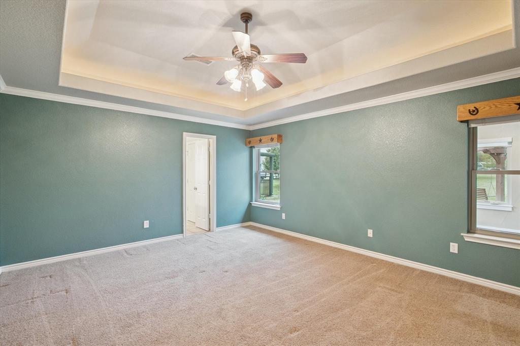 548 Highland Road Springtown, TX 76082 - Photo 18 of 40 a view of an empty room with a window