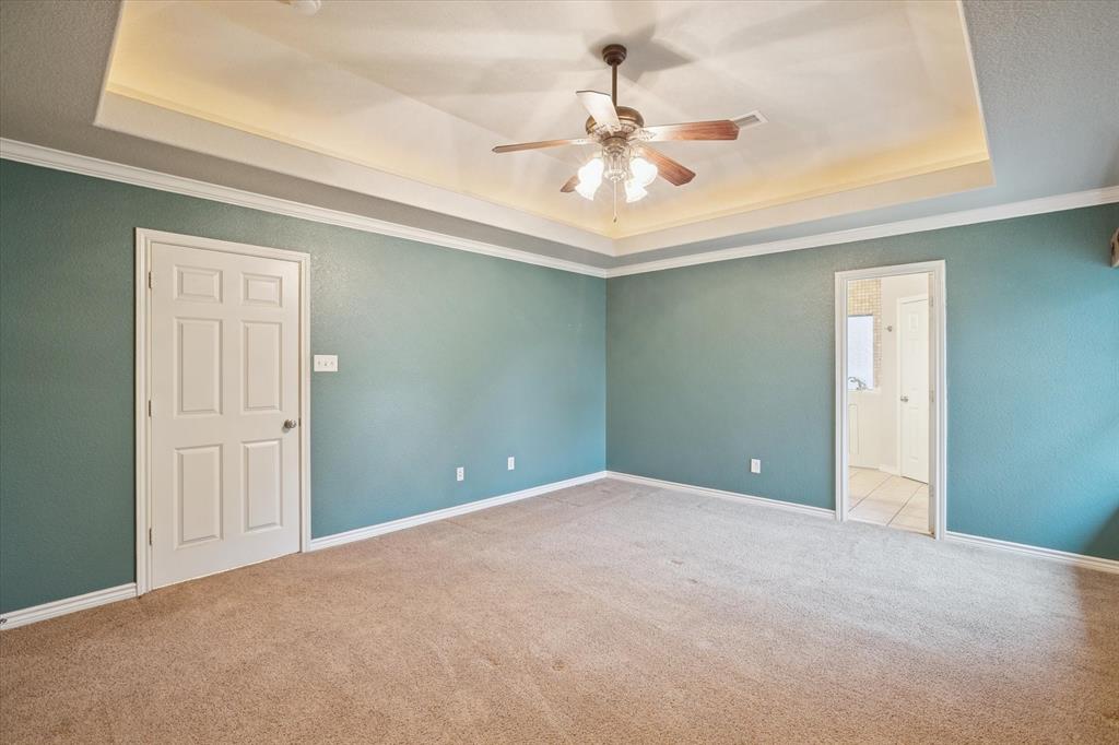 548 Highland Road Springtown, TX 76082 - Photo 20 of 40 a view of an empty room with a chandelier fan