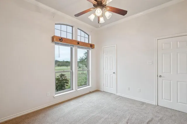 an empty room with windows and entrance