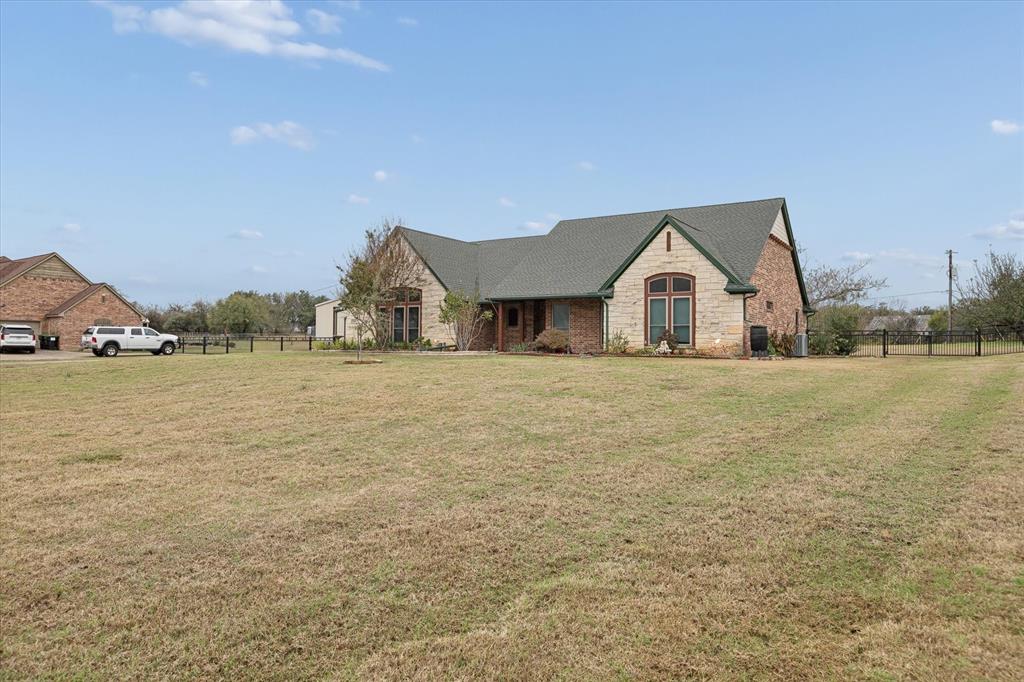 548 Highland Road Springtown, TX 76082 - Photo 3 of 40 a front view of a house with a yard