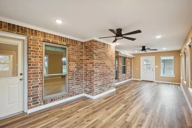 a view of livingroom with hardwood floor and a ceiling fan