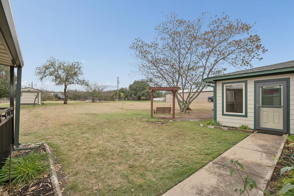 548 Highland Road Springtown, TX 76082 - Photo 34 of 40 a view of a yard with a house