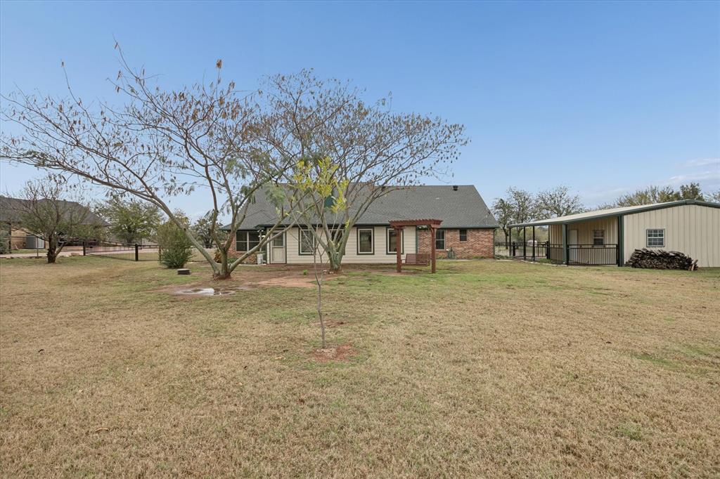 548 Highland Road Springtown, TX 76082 - Photo 38 of 40 a view of a house with a yard