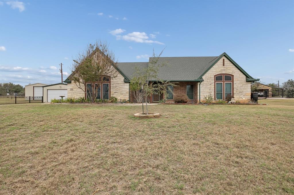 548 Highland Road Springtown, TX 76082 - Photo 4 of 40 a view of a house with a yard