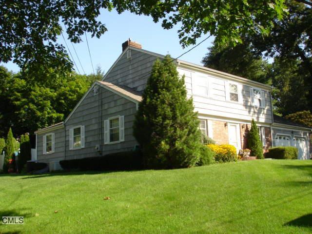 a view of house with yard