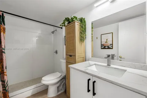 a view of a tall building with a swimming pool