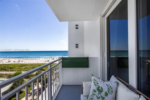 a view of a balcony with furniture