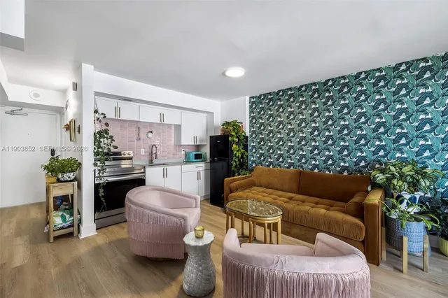 a living room with furniture and a rug