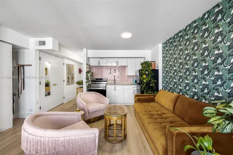 a living room with furniture and a rug