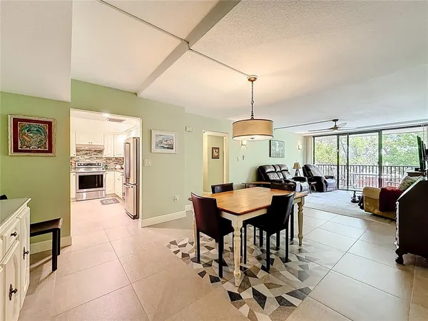 a kitchen with stainless steel appliances granite countertop a sink a stove and cabinets