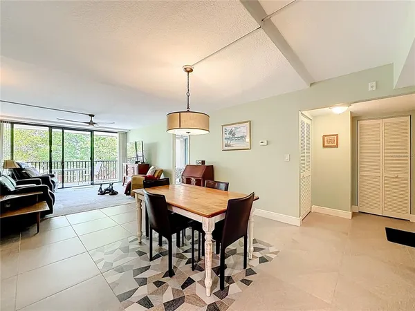 a kitchen with granite countertop white cabinets and stainless steel appliances