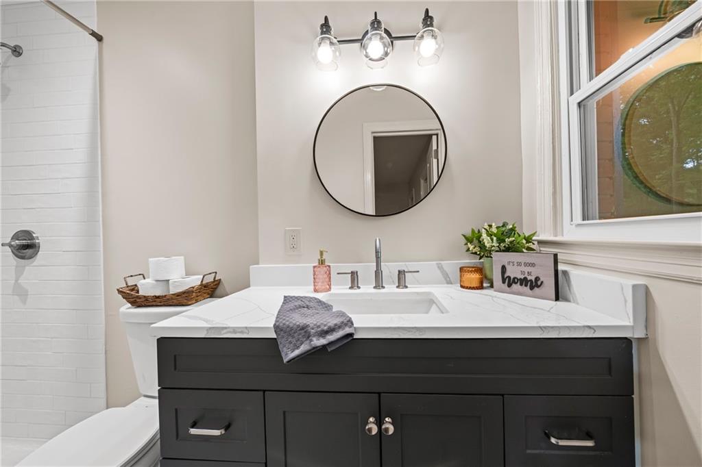 23 East Camelia Road Northeast Rome, GA 30161 - Photo 18 of 27 a bathroom with a sink and a mirror