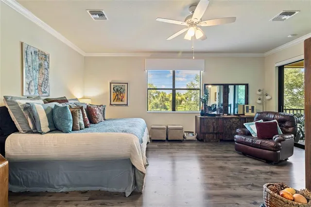 a bedroom with a large bed and a window