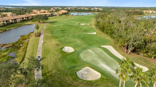 an aerial view of residential houses with yard and swimming pool