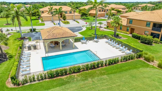an aerial view of a house with a swimming pool