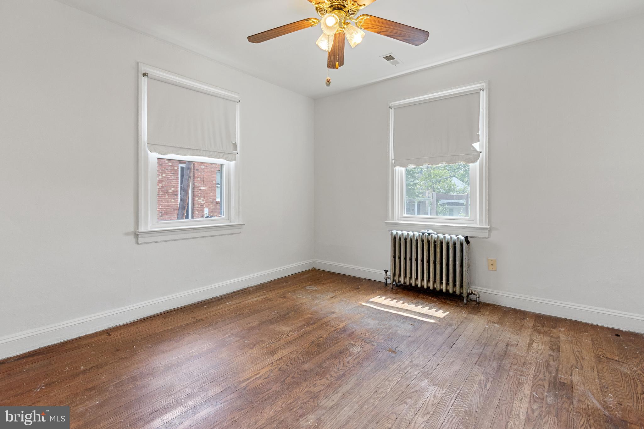 5515 Jay Street Northeast Washington, DC 20019 - Photo 6 of 20 wooden floor in an empty room with a window