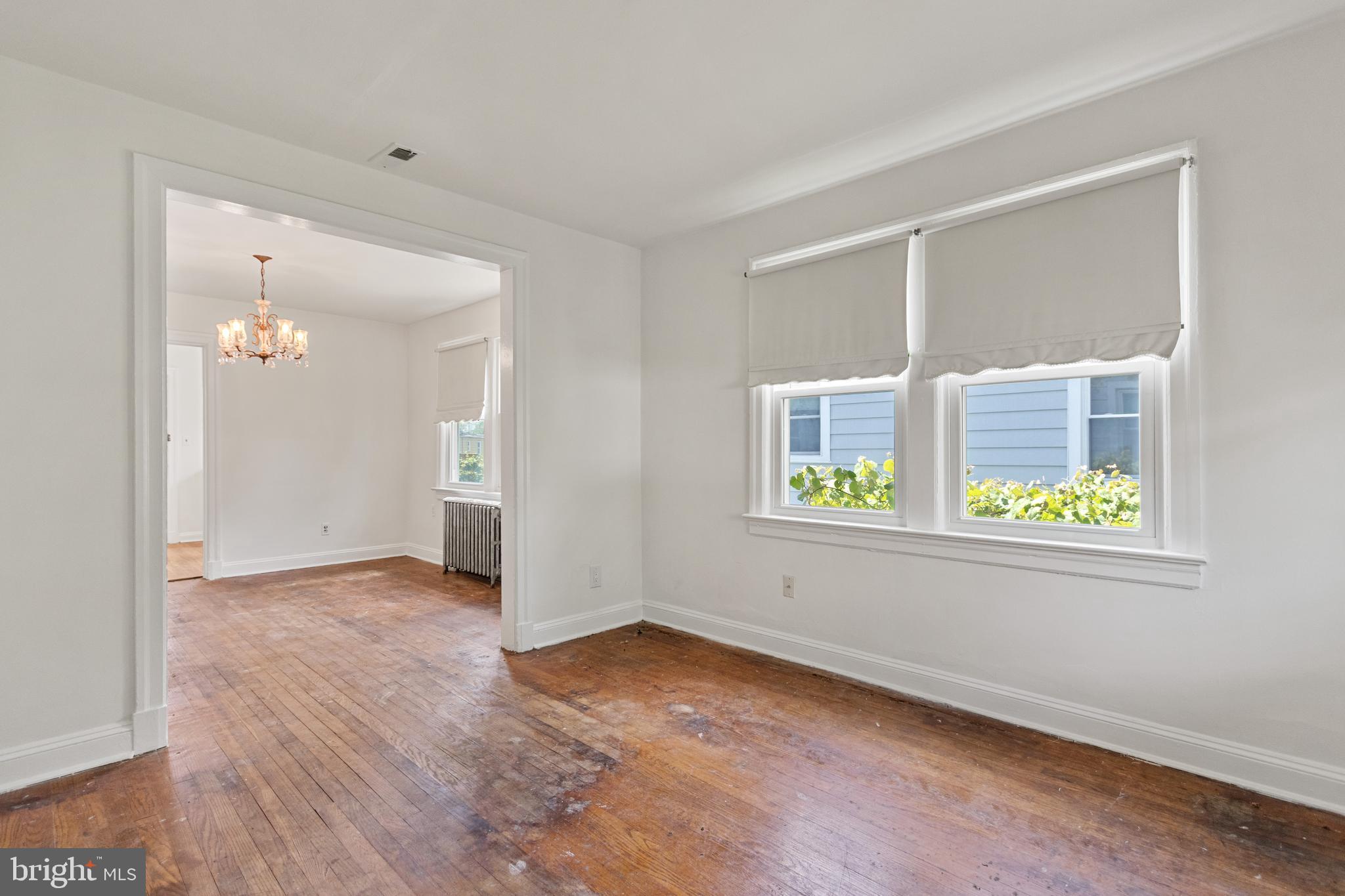 5515 Jay Street Northeast Washington, DC 20019 - Photo 7 of 20 a view of an empty room with window and wooden floor