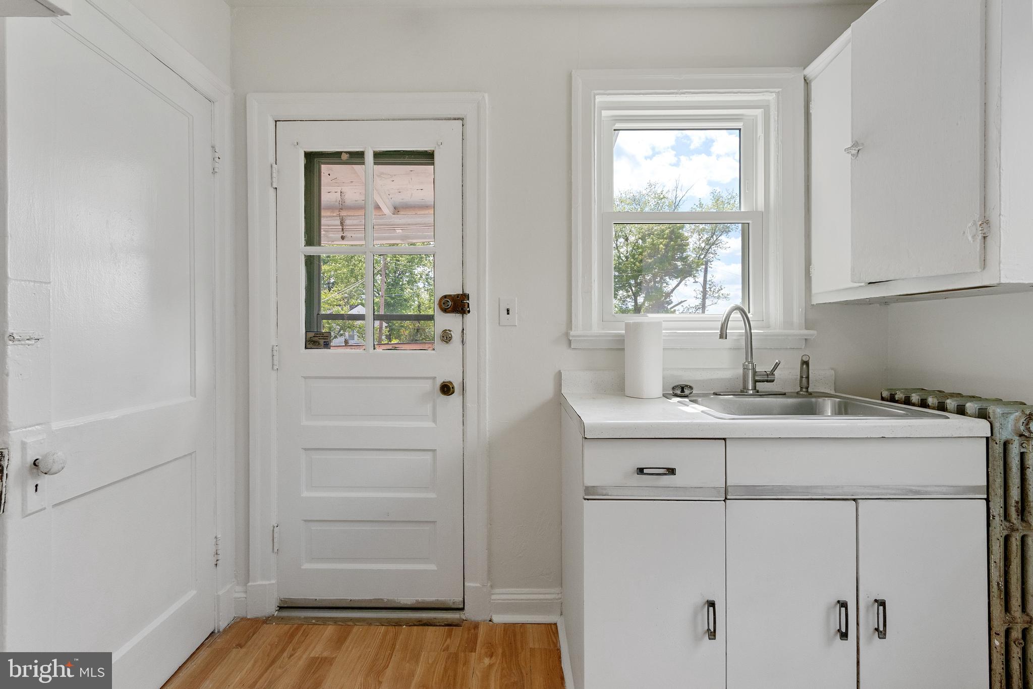5515 Jay Street Northeast Washington, DC 20019 - Photo 8 of 20 a kitchen with a stove a sink and a window