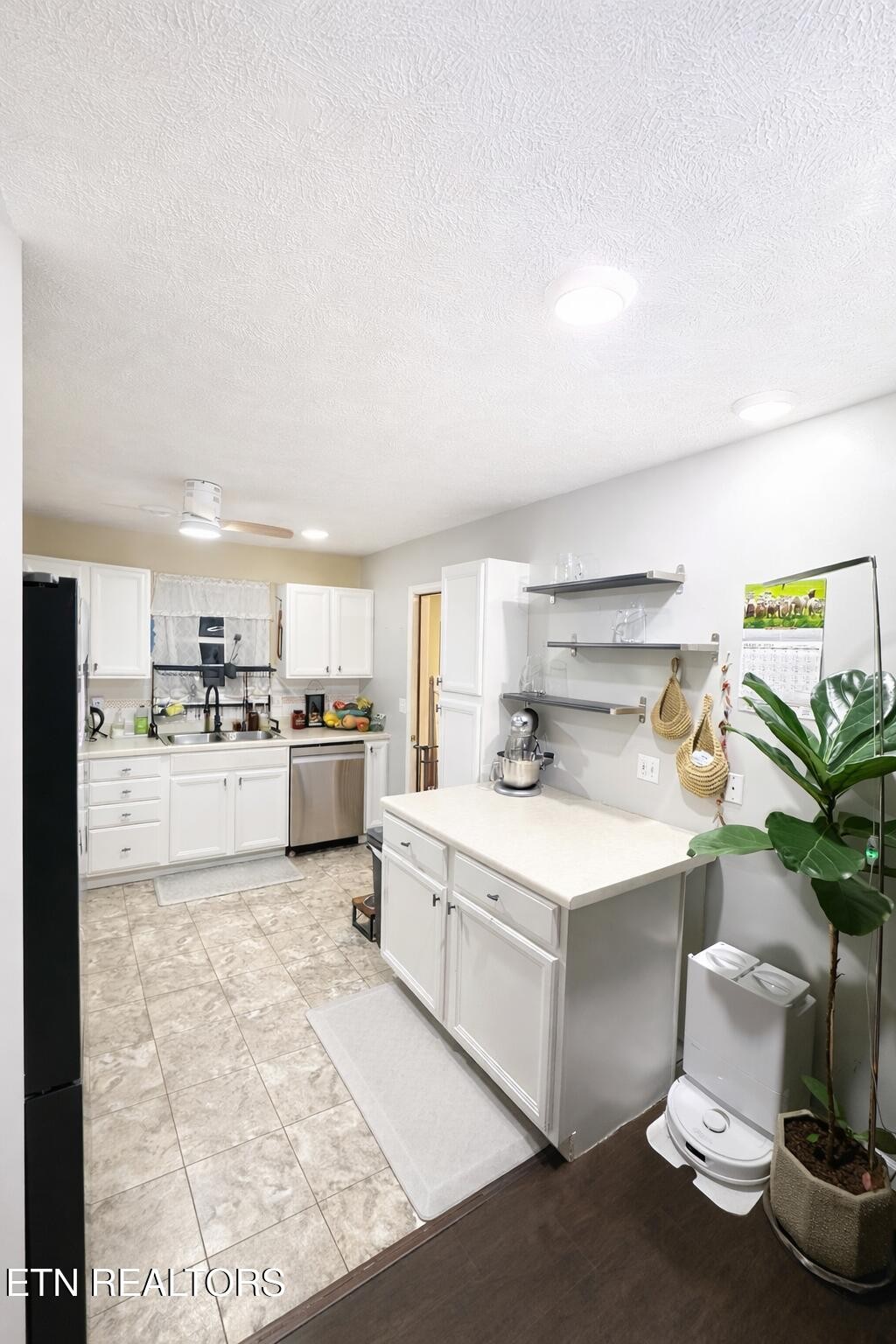 15 Rena Circle Crossville, TN 38572 - Photo 11 of 14 a kitchen with a sink and white cabinets