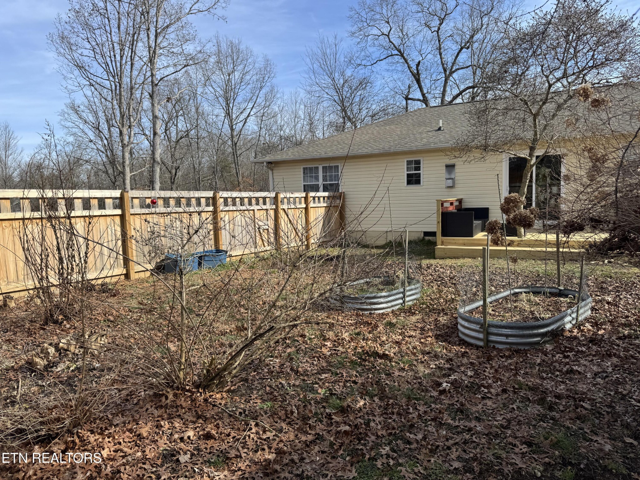 15 Rena Circle Crossville, TN 38572 - Photo 4 of 14 a view of a house with backyard and sitting area