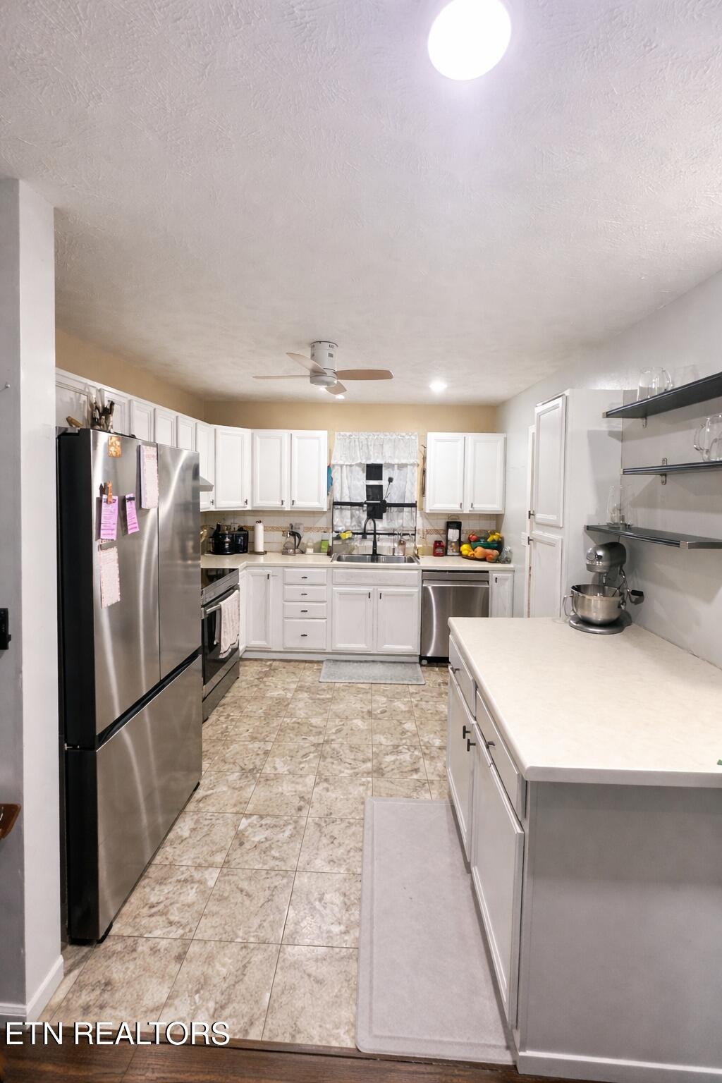 15 Rena Circle Crossville, TN 38572 - Photo 8 of 14 a kitchen with stainless steel appliances granite countertop a refrigerator sink and stove