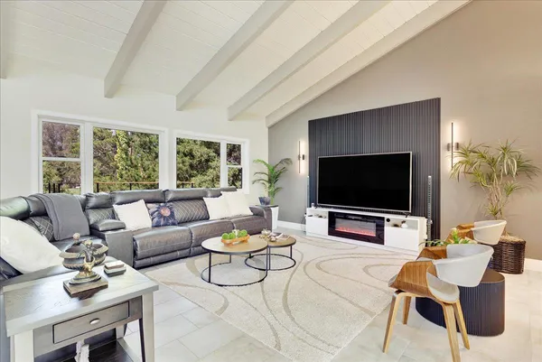 a living room with furniture and a large window