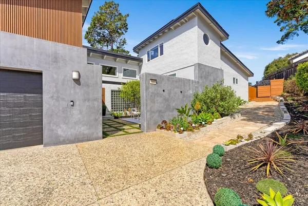 an aerial view of a house with a swimming pool