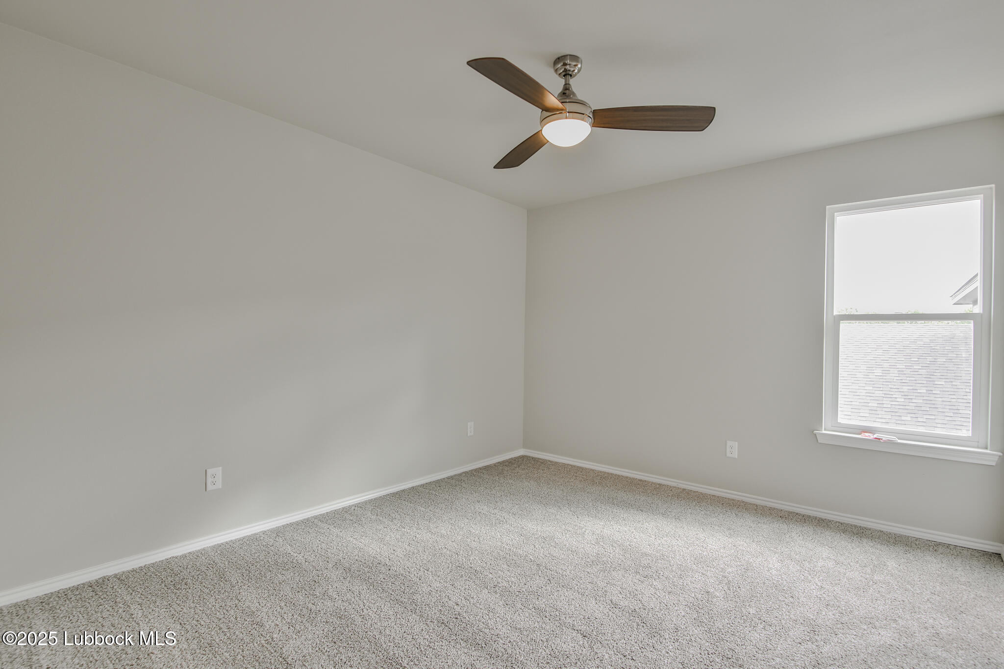 3119 74th Street Lubbock, TX 79423 - Photo 28 of 36 an empty room with a window